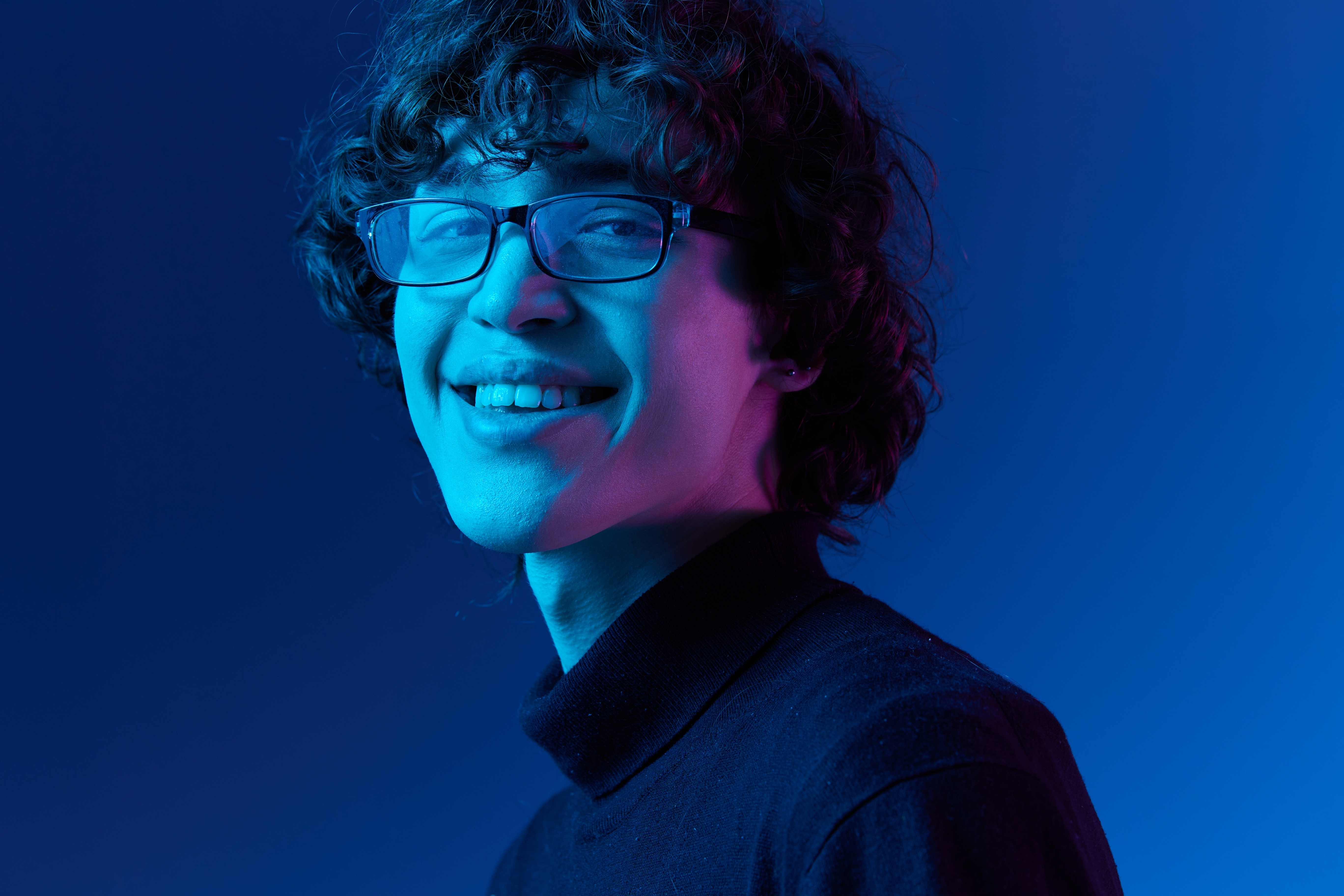 Boy in glasses with blue background.jpg