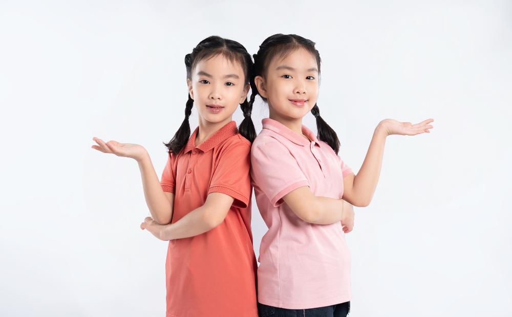 2 girls hands out comparing.jpg