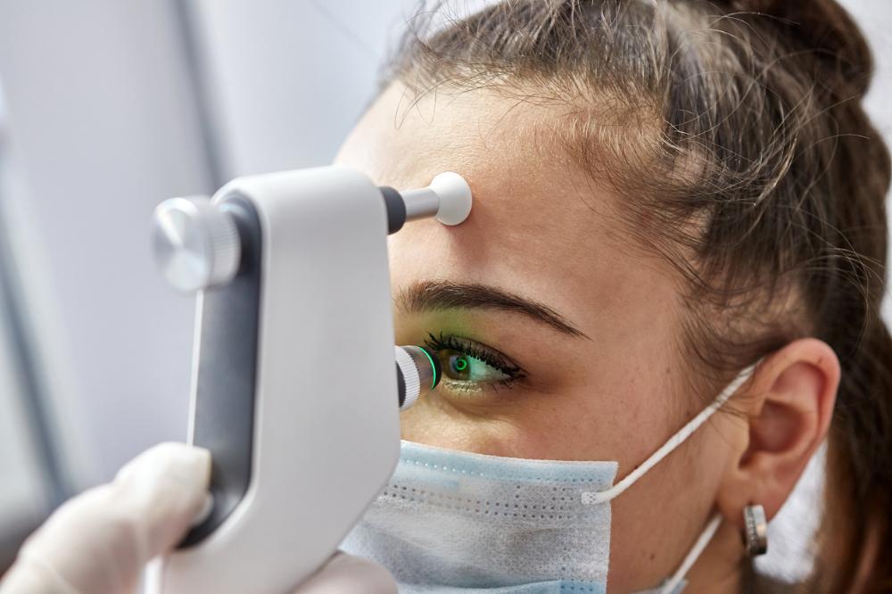 girl measures eye pressure.jpg