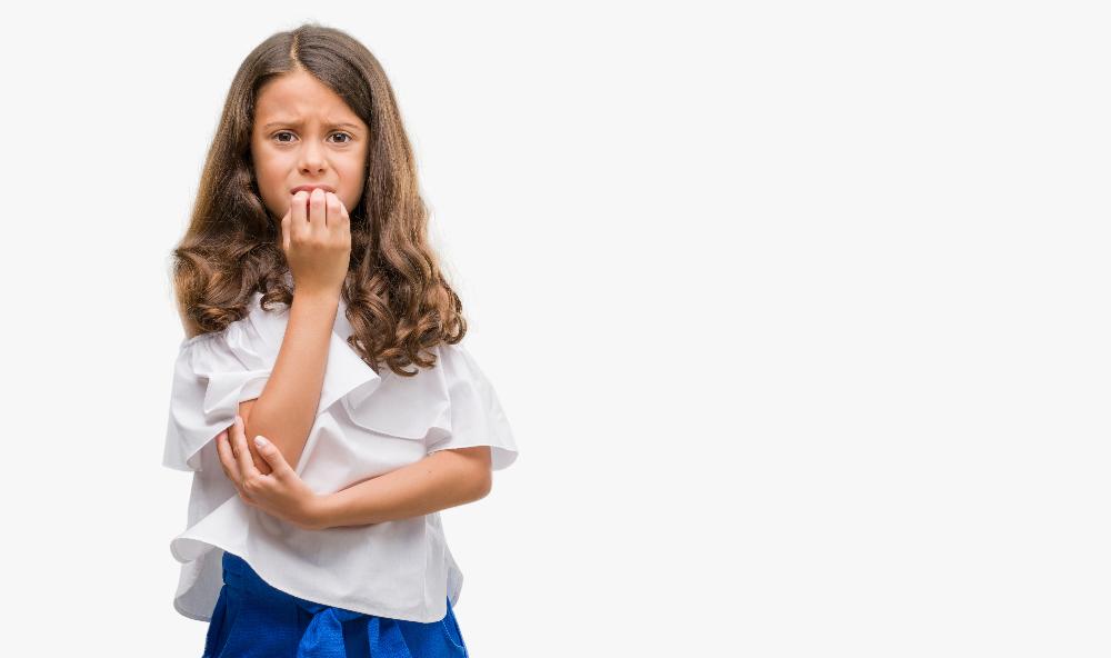 girl biting nails_Refraction challenges in children - what to prescribe.jpg