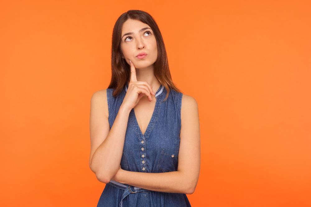 Lady thinking_Combining atropine and orthokeratology for a fast progressing myope.jpg