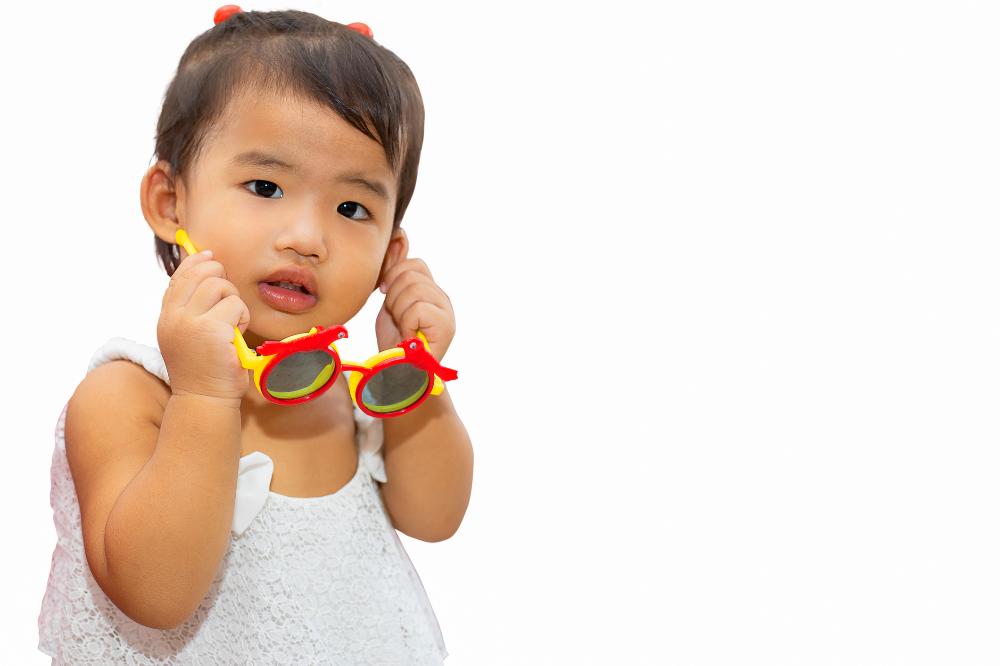 Girl with sunglasses_How to manage the highly myopic toddler.jpg