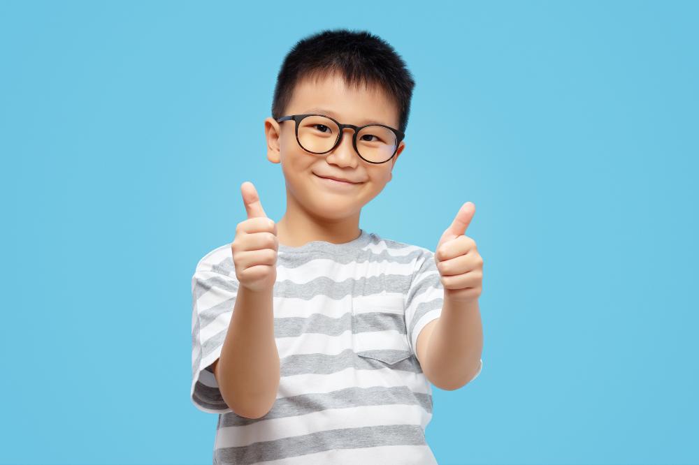 Chinese boy thumbs up.jpg