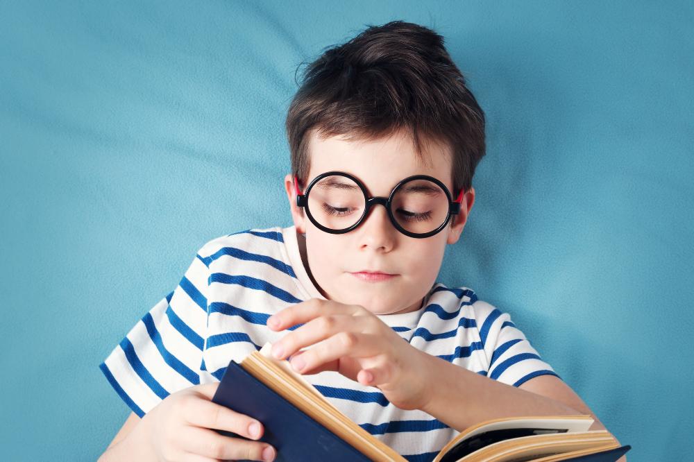 child lying with book.jpg