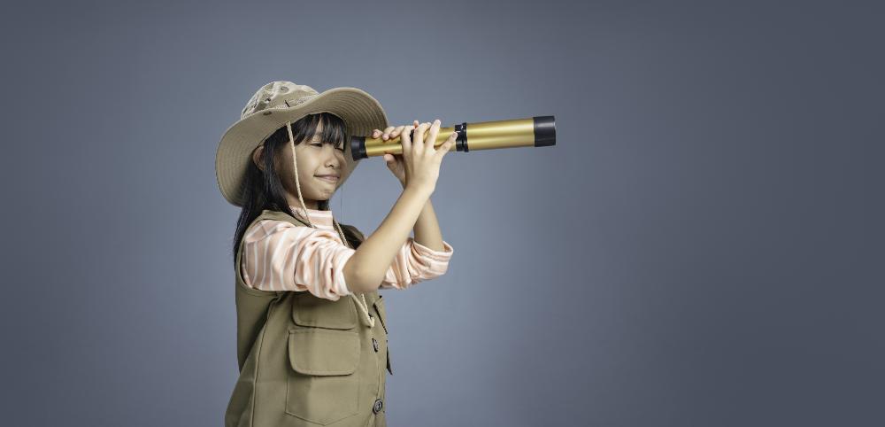 Girl holding telescope.jpg