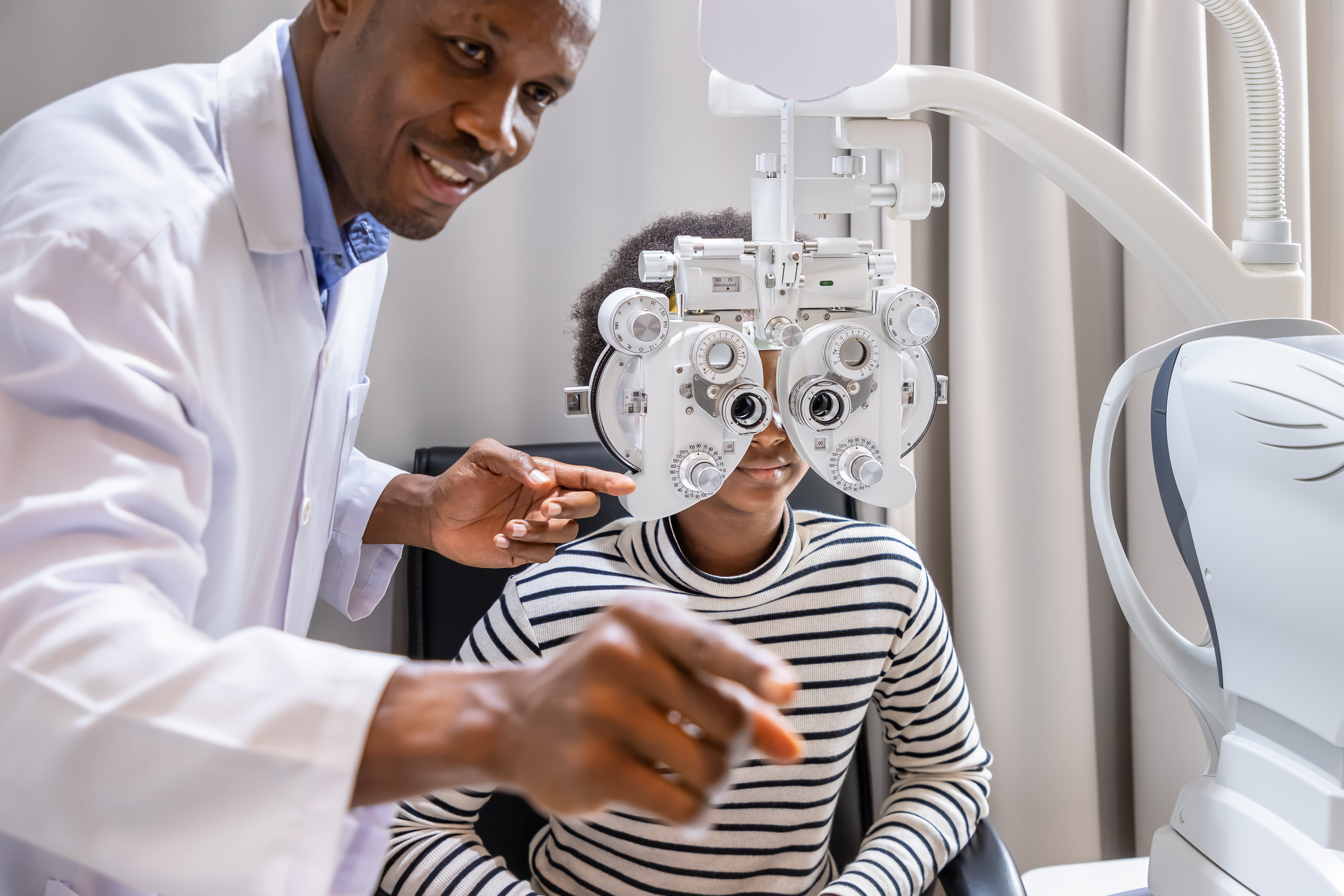 african man refraction with little kid_A low myope with long axial length.jpg