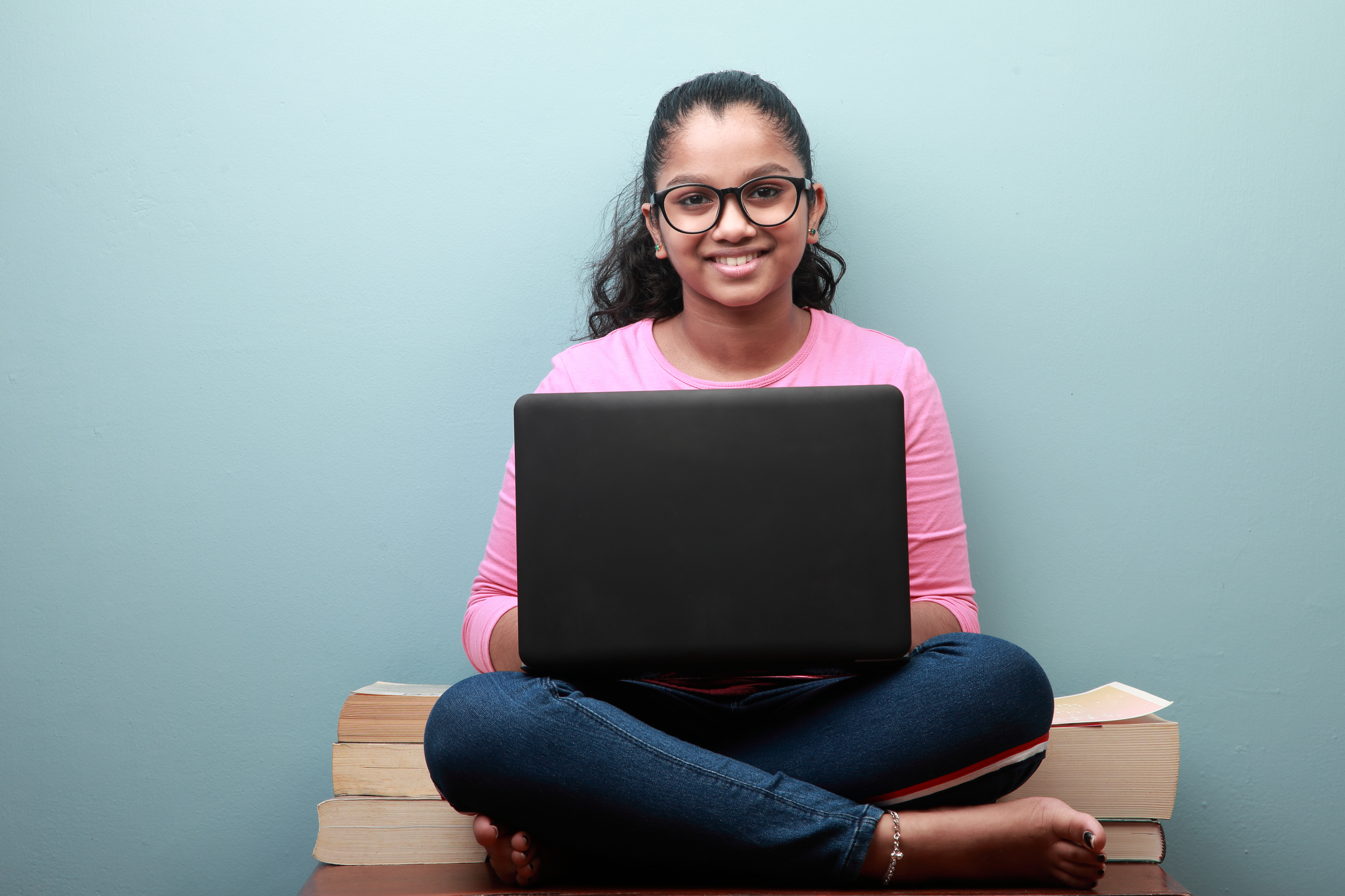 young girl with computer_Clinical Leader Case Study Managing myopia with the family.jpg